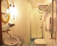 a bathroom with a sink and a toilet and a shower at Merial Hotel Sultanahmet in Istanbul