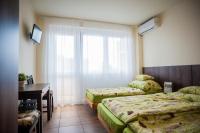Posteľ alebo postele v izbe v ubytovaní Milan Apartmanok