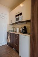 Kuchyňa alebo kuchynka v ubytovaní Milan Apartmanok