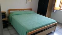 A bed or beds in a room at Villa Magnolia Appartamenti