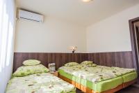 Posteľ alebo postele v izbe v ubytovaní Milan Apartmanok