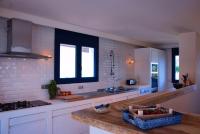 A kitchen or kitchenette at Manuki Mas