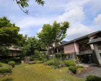 a garden in front of a building at Hotel Fuki no Mori in Nagiso