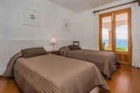 Postel nebo postele na pokoji v ubytování Villa Ca'n Torrens Alcanada