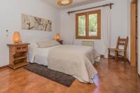 Postel nebo postele na pokoji v ubytování Villa Ca'n Torrens Alcanada