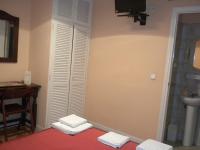A bed or beds in a room at Hostal San Martin