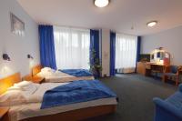 Posteľ alebo postele v izbe v ubytovaní Hotel Jaskółka