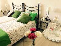A bed or beds in a room at Appartamenti Monte Alago
