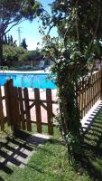 a wooden fence next to a swimming pool at Xanadu Rural in Chiclana de la Frontera