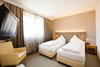 Łóżko lub łóżka w pokoju w obiekcie Stadthotel Goldenes Schiff