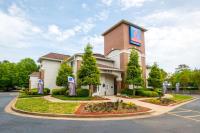 a front view of a hotel with a parking lot at Studio 6-Roswell, GA - Atlanta in Roswell