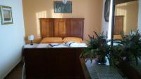 A bed or beds in a room at B&B Villa Carmen