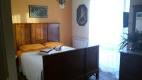 A bed or beds in a room at B&B Villa Carmen