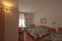 Posteľ alebo postele v izbe v ubytovaní Hotel Tirreno