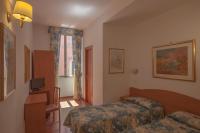 Posteľ alebo postele v izbe v ubytovaní Hotel Tirreno