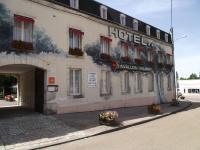 a hotel with flowers in front of a building at Cit&#39;Hotel Avallon Vauban in Avallon