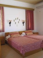 A bed or beds in a room at Vamos Palace Apartments