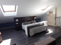 A bed or beds in a room at Apartamentos Sol de Mayo