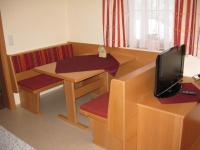 Televízia a/alebo spoločenská miestnosť v ubytovaní Ferienwohnung Ketterer