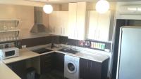 A kitchen or kitchenette at Apartamentos Sol de Mayo