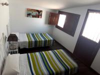 A bed or beds in a room at Apartamentos Sol de Mayo