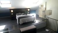 A bed or beds in a room at Apartamentos Sol de Mayo