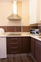 A kitchen or kitchenette at Apartamentos Sol de Mayo
