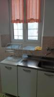 A kitchen or kitchenette at Appartamenti La Quiete