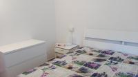 A bed or beds in a room at Appartamenti La Quiete