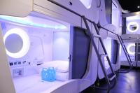 a room with a bunk bed and a ladder at Hey Bear Capsule Hotel in Taipei