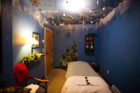 a bedroom with a christmas tree in a blue wall at Kandahar Lodge at Whitefish Mountain Resort in Whitefish