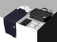 a table with a shirt and a bag on it at The Millennials Kyoto in Kyoto