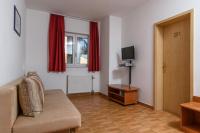 Televízia a/alebo spoločenská miestnosť v ubytovaní Boutique Hotel B&B Villa Paula