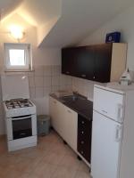 Kuchyň nebo kuchyňský kout v ubytování Trilj Apartman Jurika