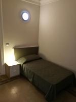 Łóżko lub łóżka w pokoju w obiekcie Ursino rooms apartment