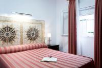 Posteľ alebo postele v izbe v ubytovaní Hostal Alhambra - Adults Only