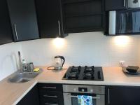 Kuchyňa alebo kuchynka v ubytovaní Widokowy Apartament nad Jeziorem