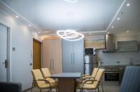 A kitchen or kitchenette at Camp Nou, Europa Fira - modern two-bedroom apartment with heating