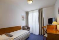 Postel nebo postele na pokoji v ubytování Hotel Maxim