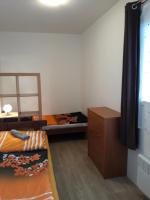 Postel nebo postele na pokoji v ubytování Apartmány Karlštejn