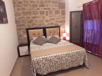 A bed or beds in a room at Apartamentos Sol de Mayo