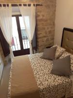A bed or beds in a room at Apartamentos Sol de Mayo