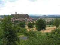 a view of a town with a castle on a hill at La Maison de Mireille in Le Puy-en-Velay