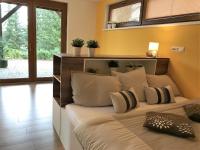 Postel nebo postele na pokoji v ubytování Apartmány Pinie Lipno