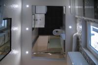 A bed or beds in a room at Camp Nou, Europa Fira - modern two-bedroom apartment with heating