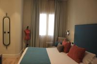 Postel nebo postele na pokoji v ubytování Hotel Palacete de Alamos