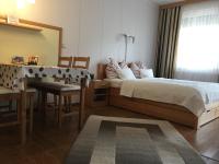 Posteľ alebo postele v izbe v ubytovaní Atmoszféra Apartman