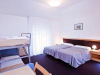Łóżko lub łóżka w pokoju w obiekcie Hotel Rubino