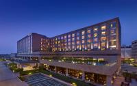 a large building with many windows at night at Hyatt Regency Chandigarh in Chandīgarh