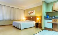 Tri Hotel Executive Caxiasにあるベッド